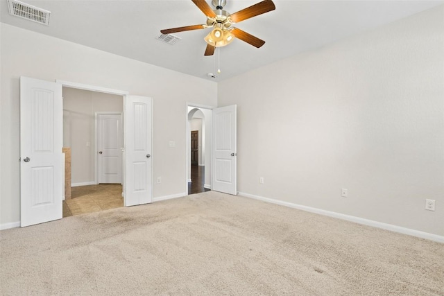 711 Rolling Oak Dr Unit 106, Round Rock, TX 78664 - unfurnished bedroom with carpet flooring, arched walkways, and baseboards