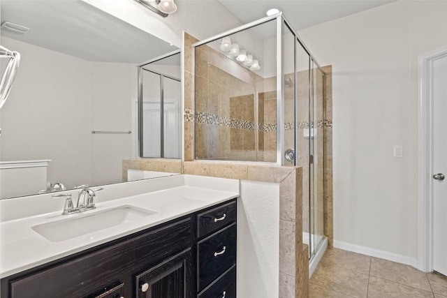 711 Rolling Oak Dr Unit 106, Round Rock, TX 78664 - bathroom featuring a shower stall, tile patterned floors, and vanity