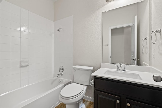 711 Rolling Oak Dr Unit 106, Round Rock, TX 78664 - bathroom featuring toilet, a textured wall, tub / shower combination, vanity, and baseboards