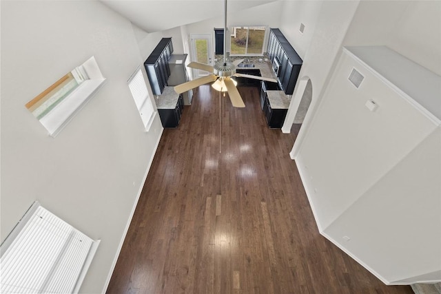 711 Rolling Oak Dr Unit 106, Round Rock, TX 78664 - unfurnished living room with dark wood finished floors and high vaulted ceiling