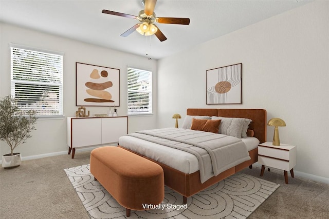 711 Rolling Oak Dr Unit 106, Round Rock, TX 78664 - carpeted bedroom featuring baseboards and a ceiling fan