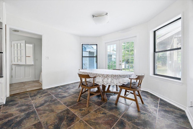 4451 County Road 467, Elgin, TX 78621 - dining space featuring dark stone finish floors and baseboards