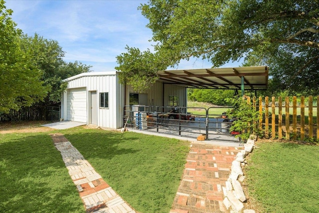 4451 County Road 467, Elgin, TX 78621 - view of yard with an outbuilding, a garage, and an exterior structure