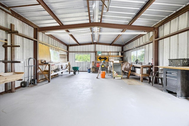 4451 County Road 467, Elgin, TX 78621 - garage featuring a workshop area and metal wall