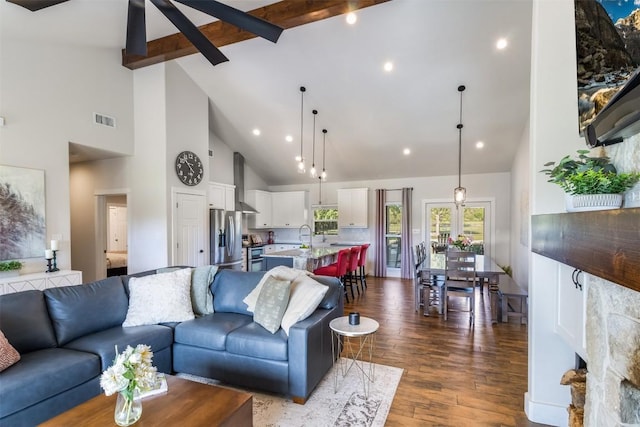 400 Capstone Dr, Marble Falls, TX 78654 - living room with high vaulted ceiling, dark wood-style flooring, beamed ceiling, and recessed lighting