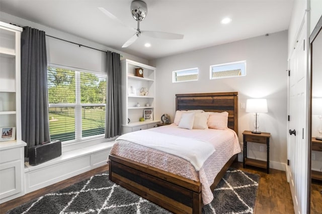 400 Capstone Dr, Marble Falls, TX 78654 - bedroom with multiple windows, dark wood-style floors, ceiling fan, and recessed lighting