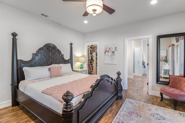 400 Capstone Dr, Marble Falls, TX 78654 - bedroom featuring baseboards, a walk in closet, wood finished floors, recessed lighting, and a ceiling fan