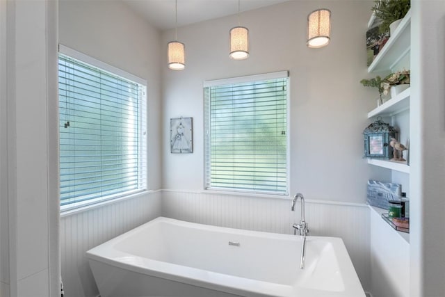 400 Capstone Dr, Marble Falls, TX 78654 - bathroom featuring a freestanding tub and a wainscoted wall