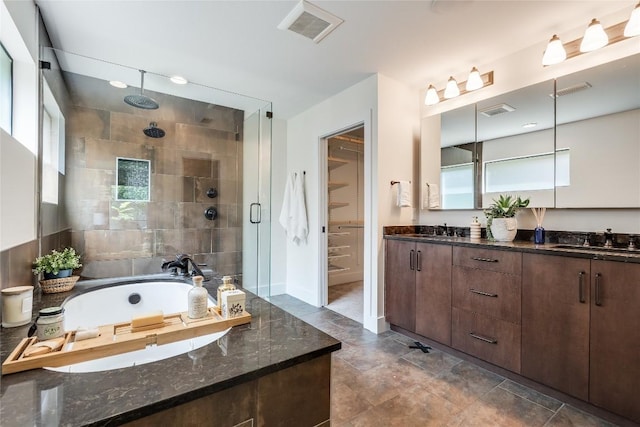 2502 Spring Creek Dr, Austin, TX 78704 - full bathroom with a shower stall, a bath, double vanity, and a closet