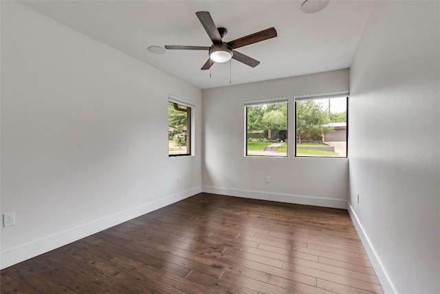 2502 Spring Creek Dr, Austin, TX 78704 - unfurnished room with ceiling fan, dark wood finished floors, and baseboards