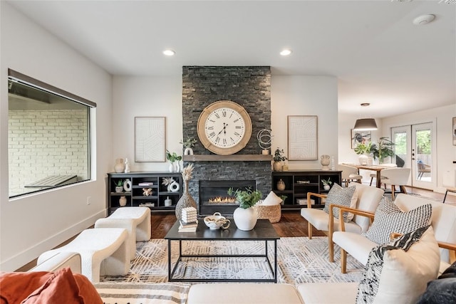 2502 Spring Creek Dr, Austin, TX 78704 - living room featuring a fireplace, wood finished floors, and baseboards