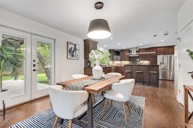2502 Spring Creek Dr, Austin, TX 78704 - dining space with french doors, wood-type flooring, and recessed lighting