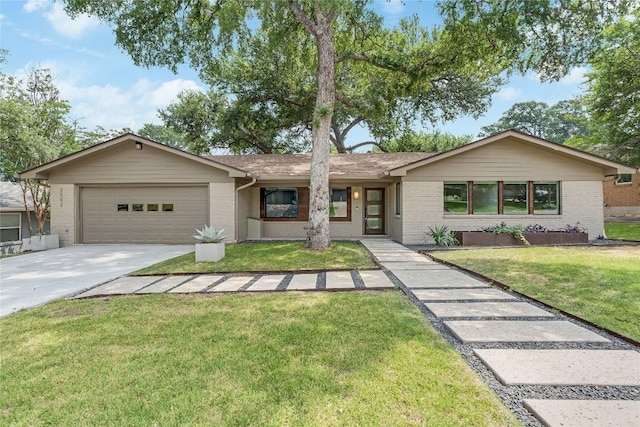 2502 Spring Creek Dr, Austin, TX 78704 - ranch-style home with brick siding, a garage, concrete driveway, and a front yard