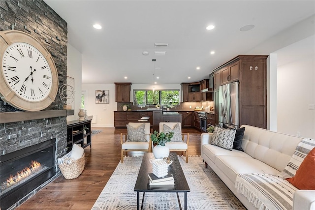 2502 Spring Creek Dr, Austin, TX 78704 - living room with wood finished floors, recessed lighting, and a stone fireplace