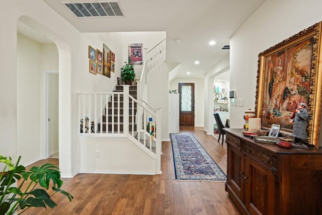 900 Lily Pad, Leander, TX 78641 - entrance foyer with stairs, wood finished floors, baseboards, arched walkways, and recessed lighting