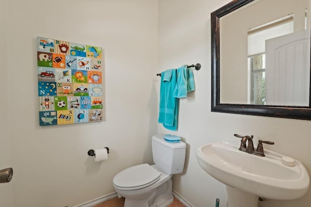 900 Lily Pad, Leander, TX 78641 - bathroom with a sink, baseboards, and toilet