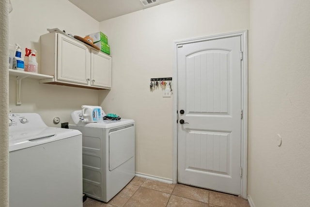 900 Lily Pad, Leander, TX 78641 - laundry area with washing machine and clothes dryer, cabinet space, baseboards, and light tile patterned floors