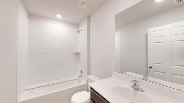 1309 Piedmont St, Temple, TX 76504 - bathroom with toilet, vanity, tub / shower combination, and recessed lighting