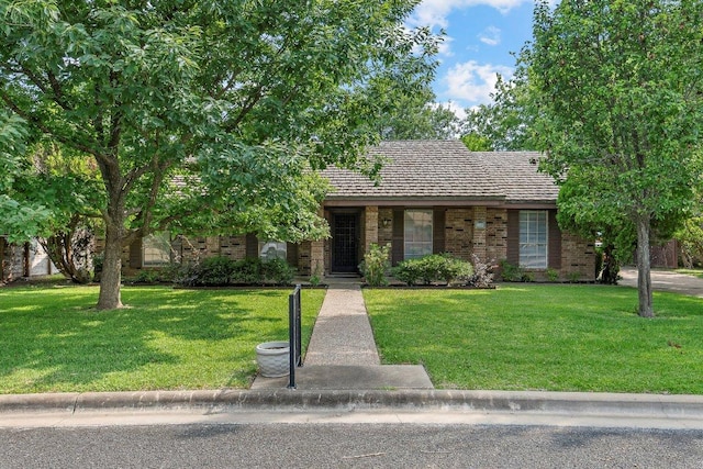 2305 Preston Trails Cv, Austin, TX 78747 - view of front facade with a front lawn and brick siding