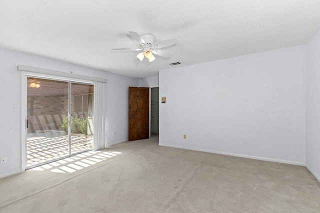 2305 Preston Trails Cv, Austin, TX 78747 - carpeted empty room featuring a ceiling fan, baseboards, and a textured ceiling