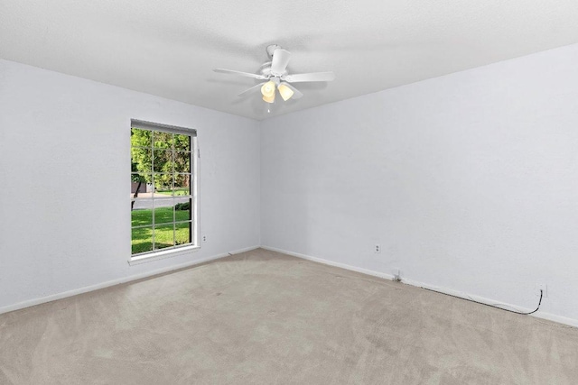 2305 Preston Trails Cv, Austin, TX 78747 - carpeted spare room with baseboards and a ceiling fan