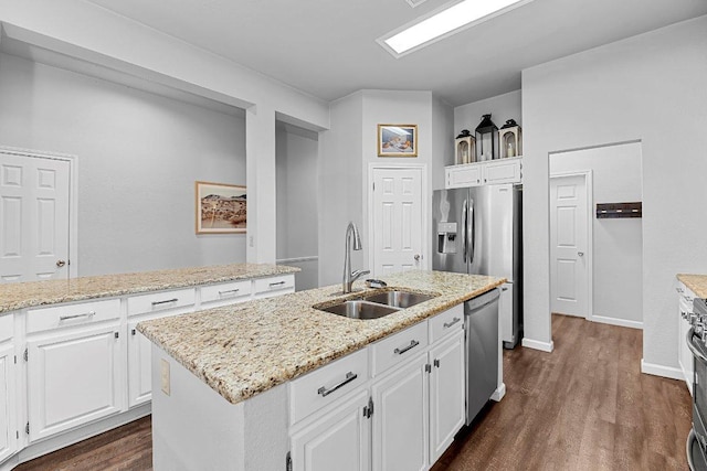 1111 Pebble Brook Rd, Cedar Park, TX 78613 - kitchen with stainless steel appliances, dark wood finished floors, white cabinets, and an island with sink