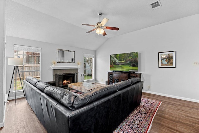 1111 Pebble Brook Rd, Cedar Park, TX 78613 - living room with ceiling fan, lofted ceiling, wood finished floors, plenty of natural light, and a brick fireplace