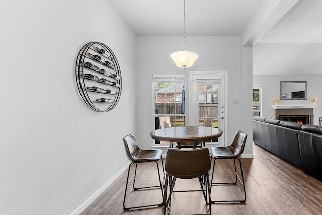 1111 Pebble Brook Rd, Cedar Park, TX 78613 - dining room featuring wood finished floors and a fireplace
