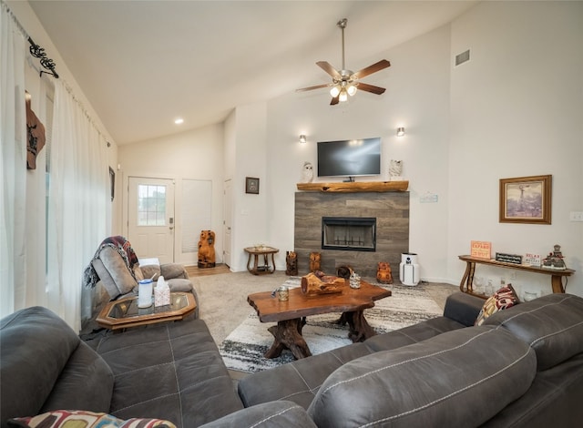 116 Naalehu Ct, Bastrop, TX 78602 - carpeted living room featuring ceiling fan, high vaulted ceiling, and a tiled fireplace