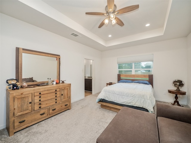 116 Naalehu Ct, Bastrop, TX 78602 - bedroom featuring baseboards, recessed lighting, light colored carpet, a raised ceiling, and connected bathroom