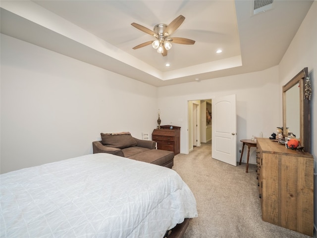 116 Naalehu Ct, Bastrop, TX 78602 - bedroom featuring light colored carpet, recessed lighting, a tray ceiling, and a ceiling fan
