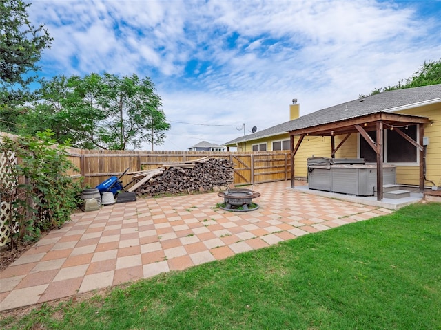 116 Naalehu Ct, Bastrop, TX 78602 - view of patio featuring a hot tub and an outdoor fire pit