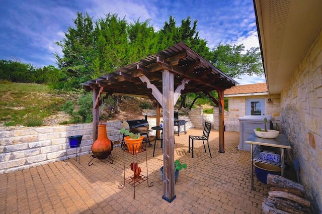 1231 Montell Rd, Wimberley, TX 78676 - view of patio featuring a pergola and area for grilling