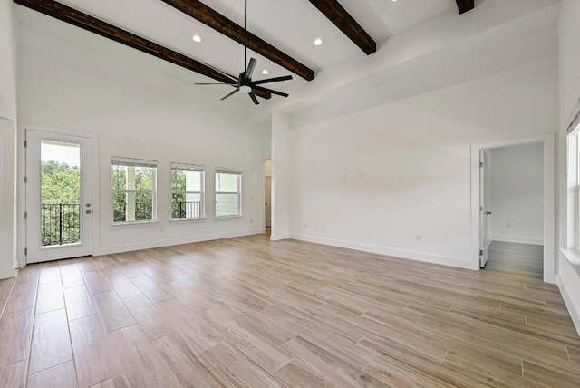2803 Wilson Ave, Lago Vista, TX 78645 - empty room featuring a ceiling fan, beam ceiling, light wood finished floors, recessed lighting, and a high ceiling