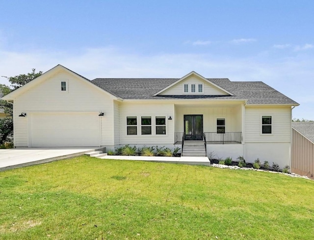 2803 Wilson Ave, Lago Vista, TX 78645 - modern farmhouse with an attached garage, a front lawn, concrete driveway, roof with shingles, and a porch