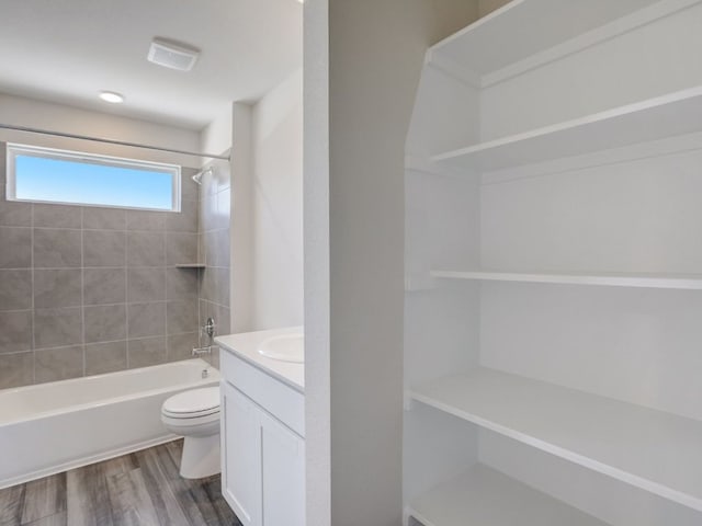 1850 Settlers Glen Dr Unit 502, Round Rock, TX 78665 - bathroom featuring toilet, wood finished floors, vanity, and shower / bath combination