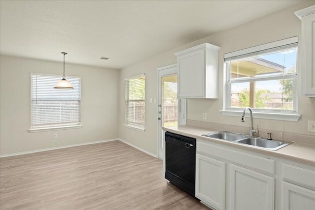15411 Ora Ln, Pflugerville, TX 78660 - kitchen with dishwasher, a sink, white cabinets, and healthy amount of natural light