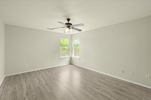 15411 Ora Ln, Pflugerville, TX 78660 - empty room with a ceiling fan and wood finished floors