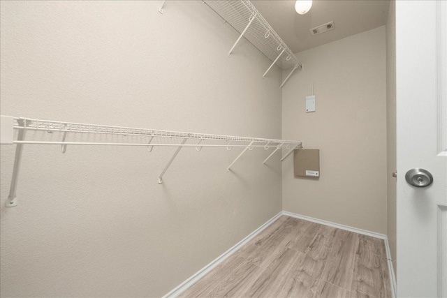 15411 Ora Ln, Pflugerville, TX 78660 - spacious closet with light wood-style floors