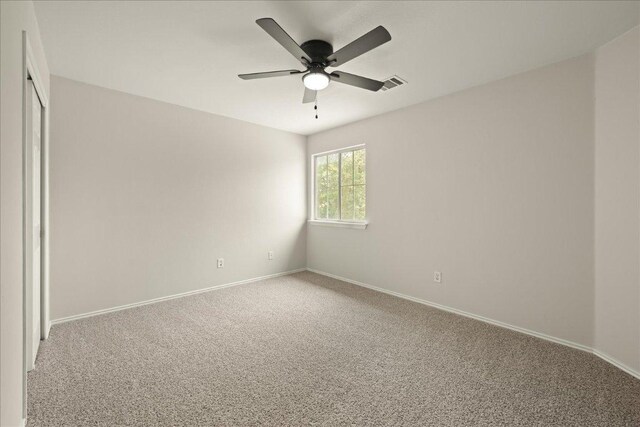 15411 Ora Ln, Pflugerville, TX 78660 - carpeted empty room featuring ceiling fan and baseboards