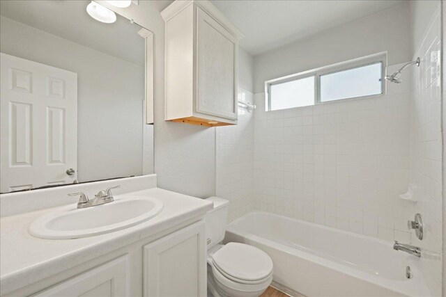 15411 Ora Ln, Pflugerville, TX 78660 - bathroom with bathtub / shower combination and vanity