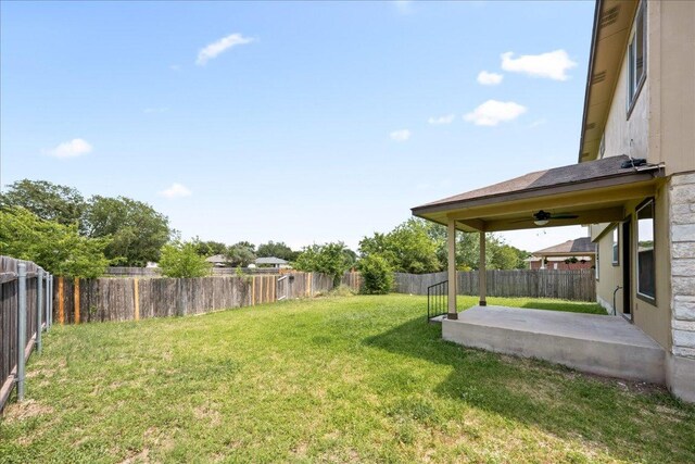 15411 Ora Ln, Pflugerville, TX 78660 - fenced backyard featuring a ceiling fan and a patio area