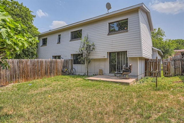 8524 Dryfield Dr, Austin, TX 78758 - back of property featuring board and batten siding and a patio area