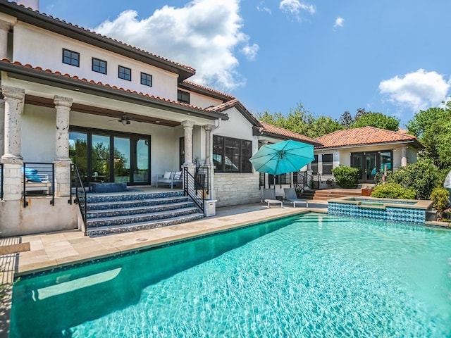 1001 Marly Way, Austin, TX 78733 - view of swimming pool with french doors, a pool with connected hot tub, a ceiling fan, and a patio