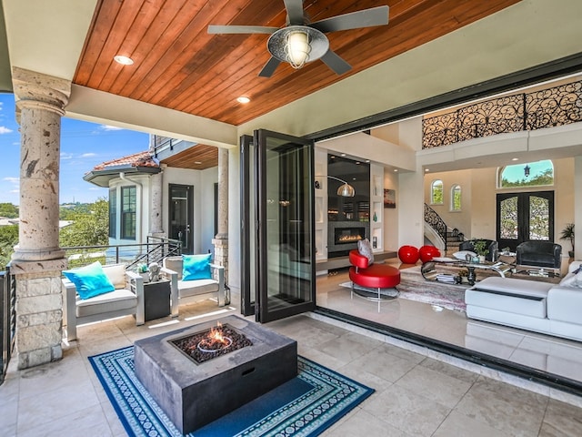 1001 Marly Way, Austin, TX 78733 - view of patio / terrace with an outdoor living space with a fire pit and ceiling fan