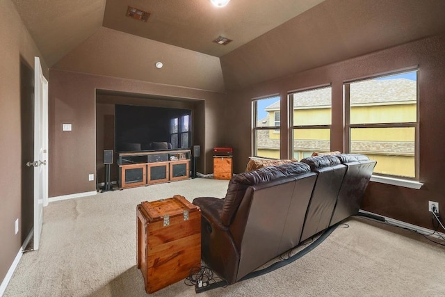 22218 W Cape Travis Bnd, Lago Vista, TX 78645 - carpeted home theater room featuring lofted ceiling and baseboards