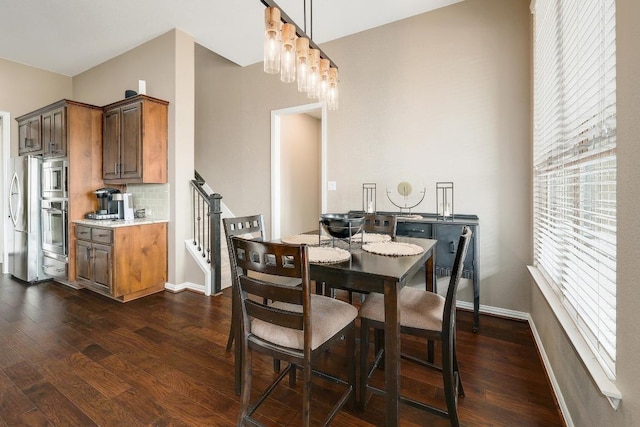 22218 W Cape Travis Bnd, Lago Vista, TX 78645 - dining area featuring dark wood-style flooring, stairs, and baseboards