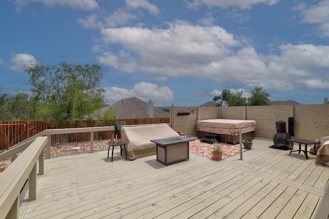 22218 W Cape Travis Bnd, Lago Vista, TX 78645 - wooden deck with a hot tub and a fenced backyard
