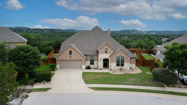 22218 W Cape Travis Bnd, Lago Vista, TX 78645 - french country home featuring stone siding, driveway, a chimney, brick siding, and an attached garage
