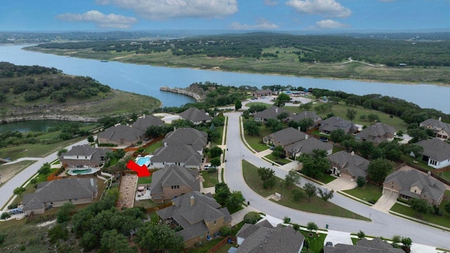22218 W Cape Travis Bnd, Lago Vista, TX 78645 - aerial overview of property's location with a nearby body of water and nearby suburban area
